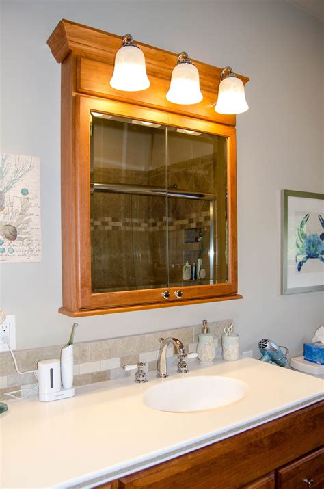 vanity light wired through medicine cabinet with no metal box|medicine cabinet with overhead lights.